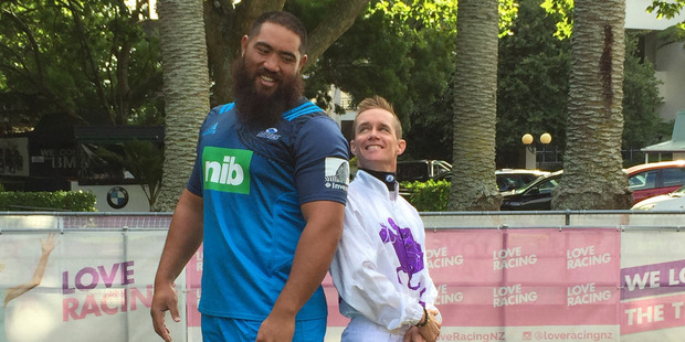 Super rugby Blues prop Charlie Faumuina and jockey Mark Du Plessis at Ellerslie. Photo / Cherie Howie