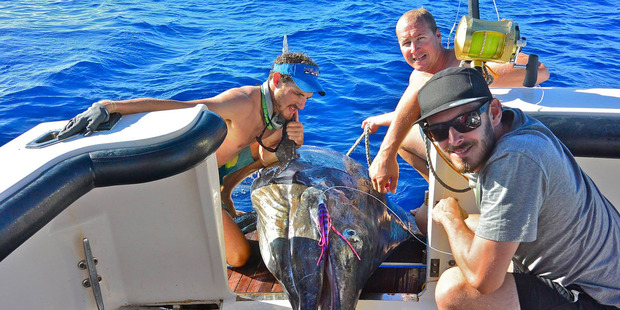 Byron Milne (left) and a Striped marlin that he caught off the cost of Western Australia. Photo / Facebook