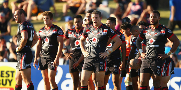 Ryan Hoffman of the Warriors and his team look dejected after a Tigers try during the round one NRL match between the Wests Tigers and the New Zealand Warriors. Photo / Getty Images.