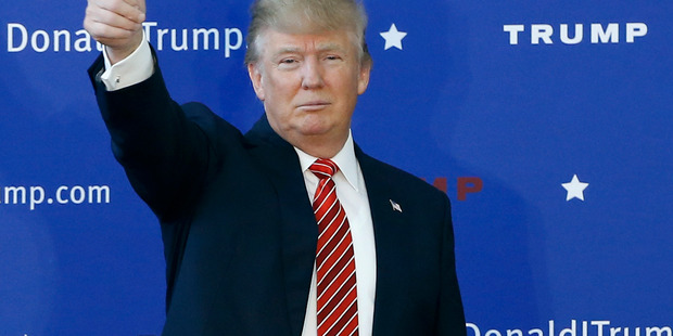 Trump expands lead, Sanders upsets Clinton in MI 