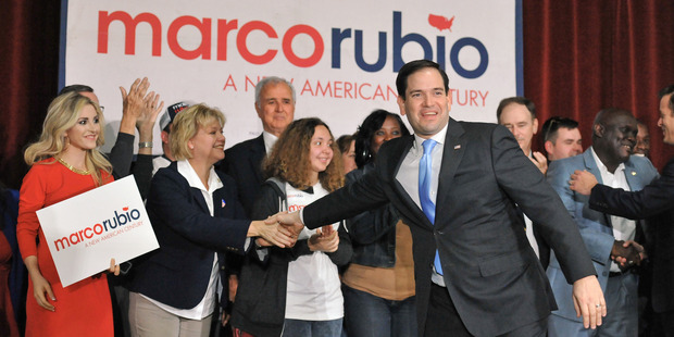 Marco Rubio shakes hands with supporters as he takes the stage during his visit to Jacksonville, Fla., Saturday, March 5, 2016. (Bob Self/The Florida Times-Union via AP) MANDATORY CREDIT