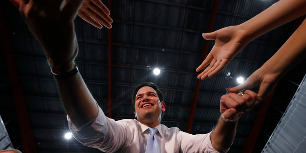 Republican presidential candidate, Sen. Marco Rubio, R-Fla., shakes hands at a rally in Toa Baja, Puerto Rico, Saturday, March 5, 2016. (AP Photo/Paul Sancya)