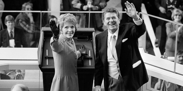 President Ronald Reagan and first lady Nancy Reagan wave to onlookers at the Capitol building. Photo / AP