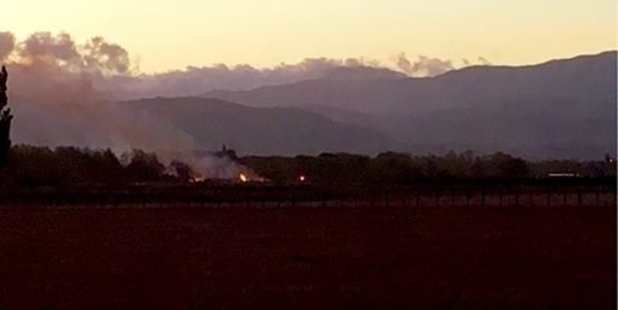 SUSPICIOUS: A grass fire burns in a field near the Masterton Motorplex drag strip in Manaia Rd on Wednesday at dusk. PHOTO/TIM EMERSON