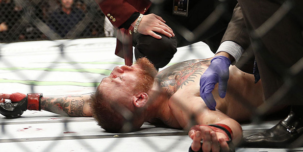 Conor McGregor recovers shortly after a second round-submission to Nate Diaz. Photo / AP