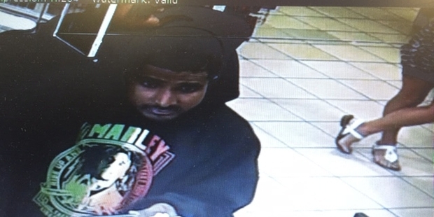 A CCTV image of a man using Ria Pou's credit card.