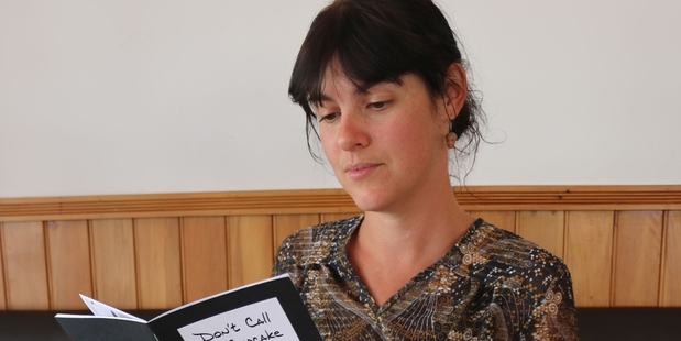 PERUSING: Sam Dew, pictured with her zine collection, is behind the Featherston Zine Club, which will meet on the third Thursday of each month at the Featherston Community Centre.PHOTO/HAYLEY GASTMEIER