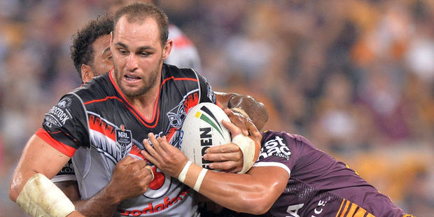 Simon Mannering is tackled by Brisbane Broncos defenders. Photo / Getty
