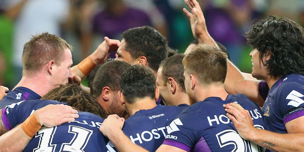 The Storm players celebrate a try in their round one win over the Dragons. Photo / Getty