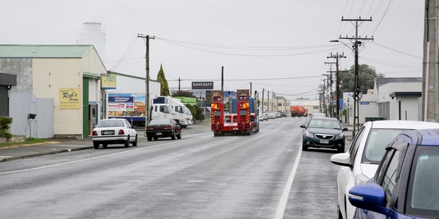 Three men kicked their way inside a Niven St property yesterday morning, in the commercial area of Onekawa. Photo / Warren Buckland
