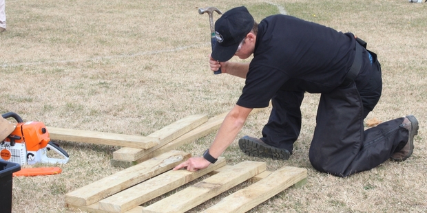 Richard French, 26, from the Tikokino Young Farmers Club, builds a drafting gate.
