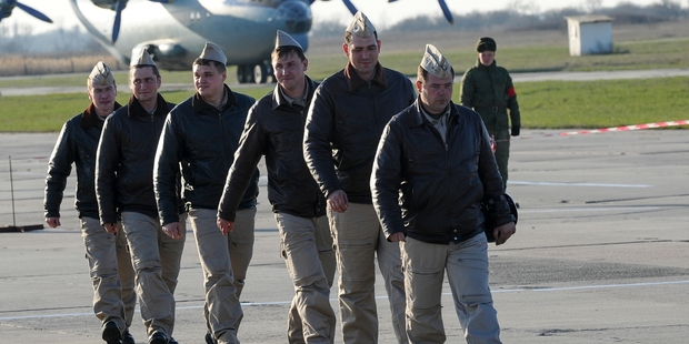 Russian pilots arrive at an air base in Primorsko-Akhtarsk, southern Russia, their Syrian mission over for now. Photo / AP