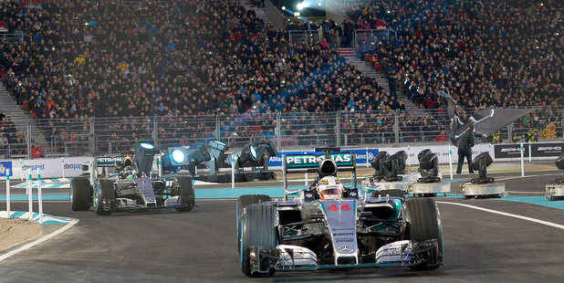 Lewis Hamilton steers his racer in front of his Mercedes teammate Nico Rosberg. Photo Getty Images