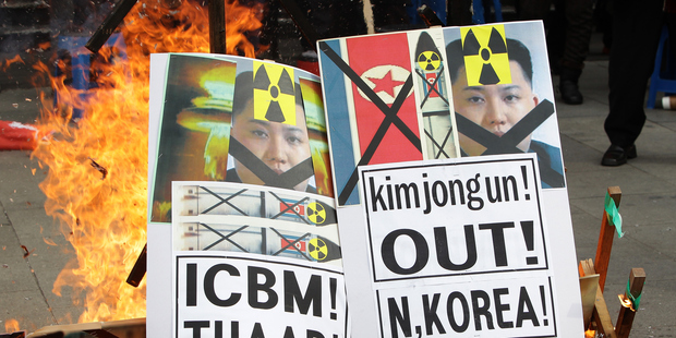South Korean protesters burn an placards of North Korea leader Kim Jong-Un during an anti-North Korea rally. Photo / Getty Images