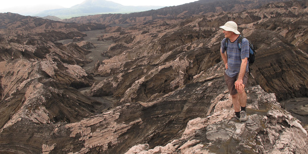 The professor surveys the desolate landscape of Ambrym Island's volcanic interior. Photo / Peter de Graaf