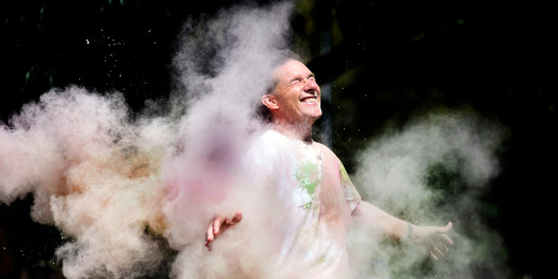 Graeme Dingle Foundation Bay of Plenty regional manager Dan Allen-Gordon gets a blast of colourful dust at the teaser event for Colour Dash.