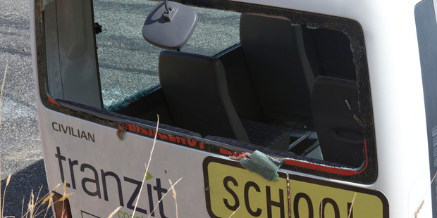 The rear window from which six students escaped after their school bus rolled on it's side. Photo / Mark Mitchell