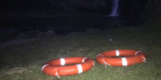 The scene at Hunua falls today where one person got into difficulty swimming and another is missing. Photo / Susan Strongman