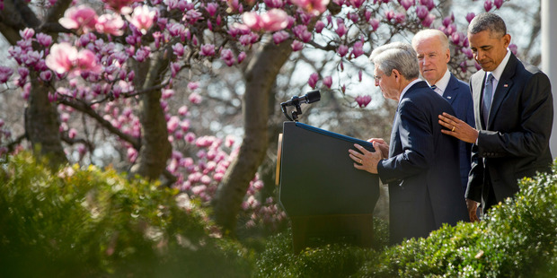Federal appeals court judge Merrick Garland, left, accompanied by President Barack Obama and Vice President Joe Biden. Photo / AP