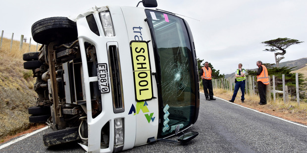 A bus carrying six children has overturned on Great South Road on a school trip, with no injuries, Makara, Wellington, New Zealand, Friday, March 18, 2016. Photo / SNPA / Marty Melville