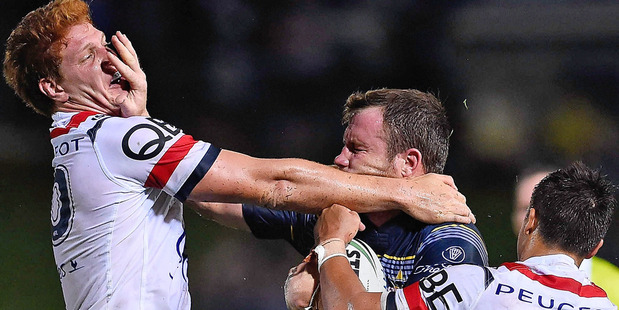 Gavin Cooper of the Cowboys fends Dylan Napa. Photo / Getty