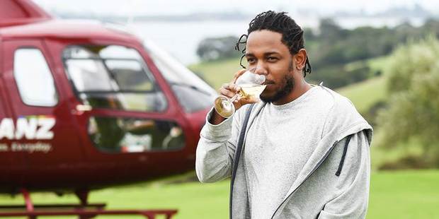 Kendrick Lamar enjoys a glass of wine during a visit to Waiheke. The rapper is the headliner at tomorrow's Auckland City Limits festival at Western Springs.
