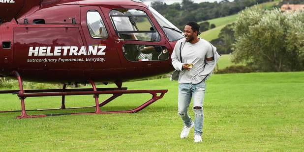 Kendrick Lamar enjoys a glass of wine during a visit to Waiheke Island.