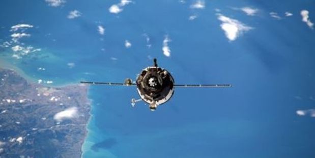 British astronaut Tim Peake has caught the process of a Russian spacecraft Soyuz 46S docking with the ISS tonight - with planet Earth some 400km away in the background. Photo: @astro_timpeake/Twitter