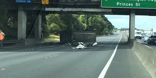 The truck's load, believed to be rubbish, was strewn across the southbound lanes. Photo / Supplied via Mitch Cuevas