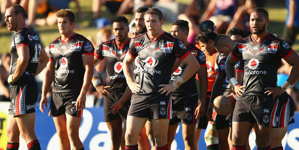 Ryan Hoffman of the Warriors and his team look dejected after a Tigers' try in round one. Photo / Getty
