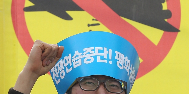 An anti-war protester during a rally opposing the joint military exercises between the US and South Korea. Photo / AP