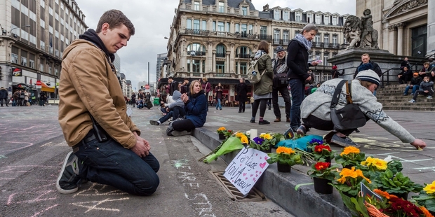 Messages and flower tributes have appeared around Brussels since the attacks. Photo / AP