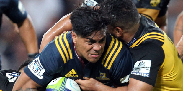 Highlanders centre Malakai Fekitoa carries against the Hurricanes. Photo / Getty