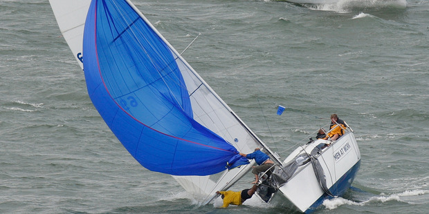 A crewman on the yacht Men At Work falls overboard during the Auckland Anniversary Day Regatta, on Auckland's Waitemata Harbour. Photo / Brett Phibbs