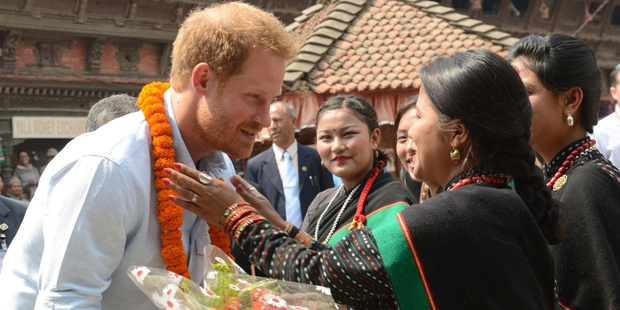 Five virgins, symbolising purity and luck, give Britain's Prince Harry an official welcome. Photo / AP