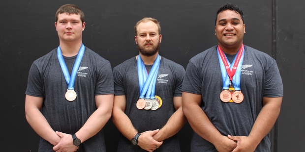 Rory Taylor (centre) with his medals at the 2015 Pacific Games held in Port Moresby, Papua New Guinea.