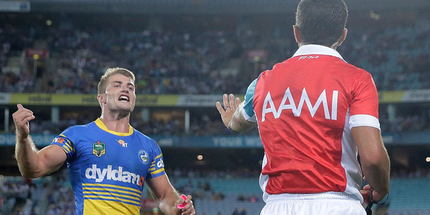 Referee Matt Cechin speaks to Kieran Foran. Photo / Getty