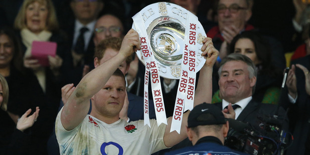 England captain Dylan Hartley holds up the Triple Crown trophy. Photo / AP