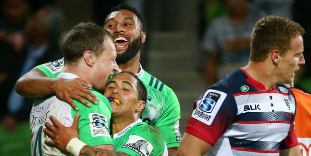 The Highlanders celebrate a try against the Rebels. Photo / Getty