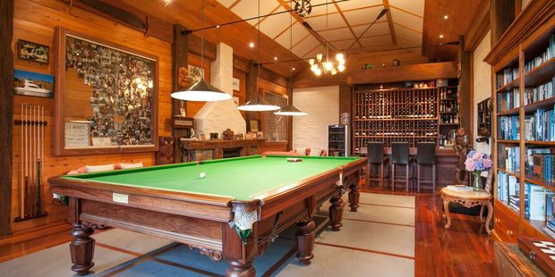 The property boasts a home theatre, games room and bar, formal and informal living areas, five bedrooms, four bathrooms, three-car garaging and a one-bedroom guest wing. Photo / Jason Tregurtha