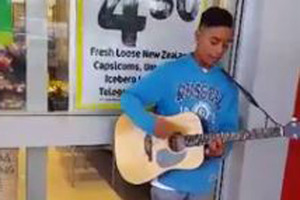 The young man identified only as Tyrone performing a stirring rendition of the Charlie Puth song on an acoustic guitar. Photo: Sharik Hussein/Facebook