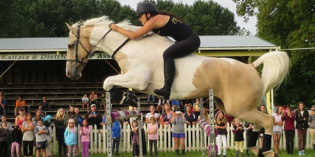 FLYING: Alycia Burton puts Classic Goldrush over a jump during a free showjumping exhibition and horse training advice clinic in Kaitaia.