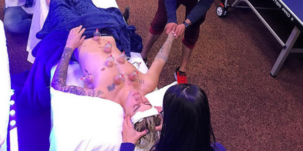 Justin Bieber gets massaged by three people. Photo / Instagram