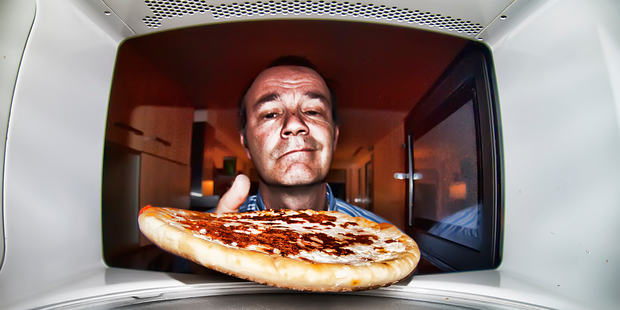 A series of experiments show how data and Wi-Fi signals can pass through the oven's protective casing, proving small amounts of microwave energy can escape. Photo / Getty