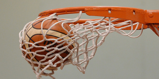 A ball goes into a basket. Photo / Getty Images