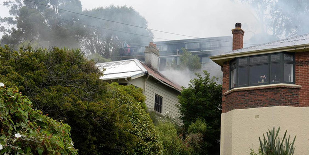 The house in Ravensbourne Rd, Maia, burns. Photo / Otago Daily Times