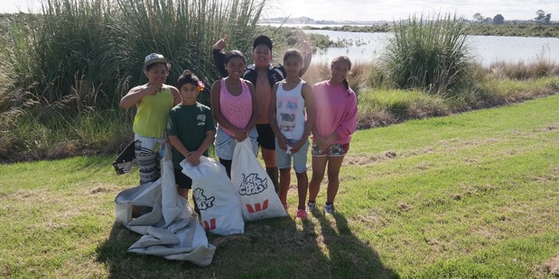Students from the Te Kura Kaupapa in Mangere, enjoying themselves while giving some love to the Manukau Harbour.