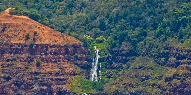 Waterfalls cascade in the Waimea Canyon park. Here you can also take bicycle tours or hike the Kukui trail. Photo / Hawaii Tourism