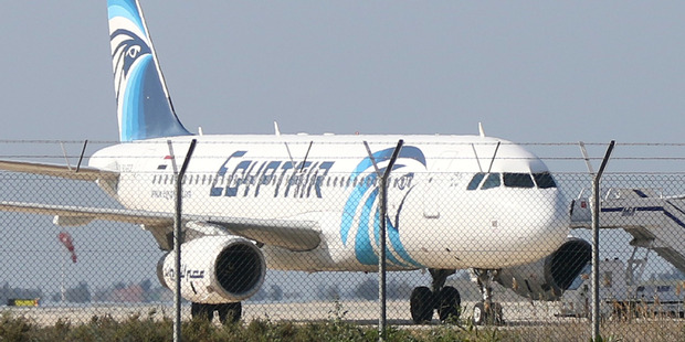 The Egypt Air Airbus A-320 sits on the tarmac of Larnaca airport after it was hijacked and diverted to Cyprus. Photo / AFP