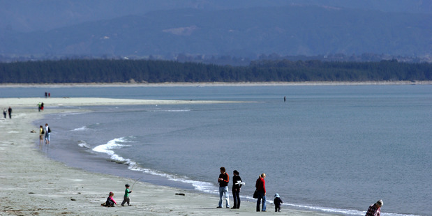 Tahuna beach with Mt Arthur in the distance in Nelson. Photo / Tim Cuff